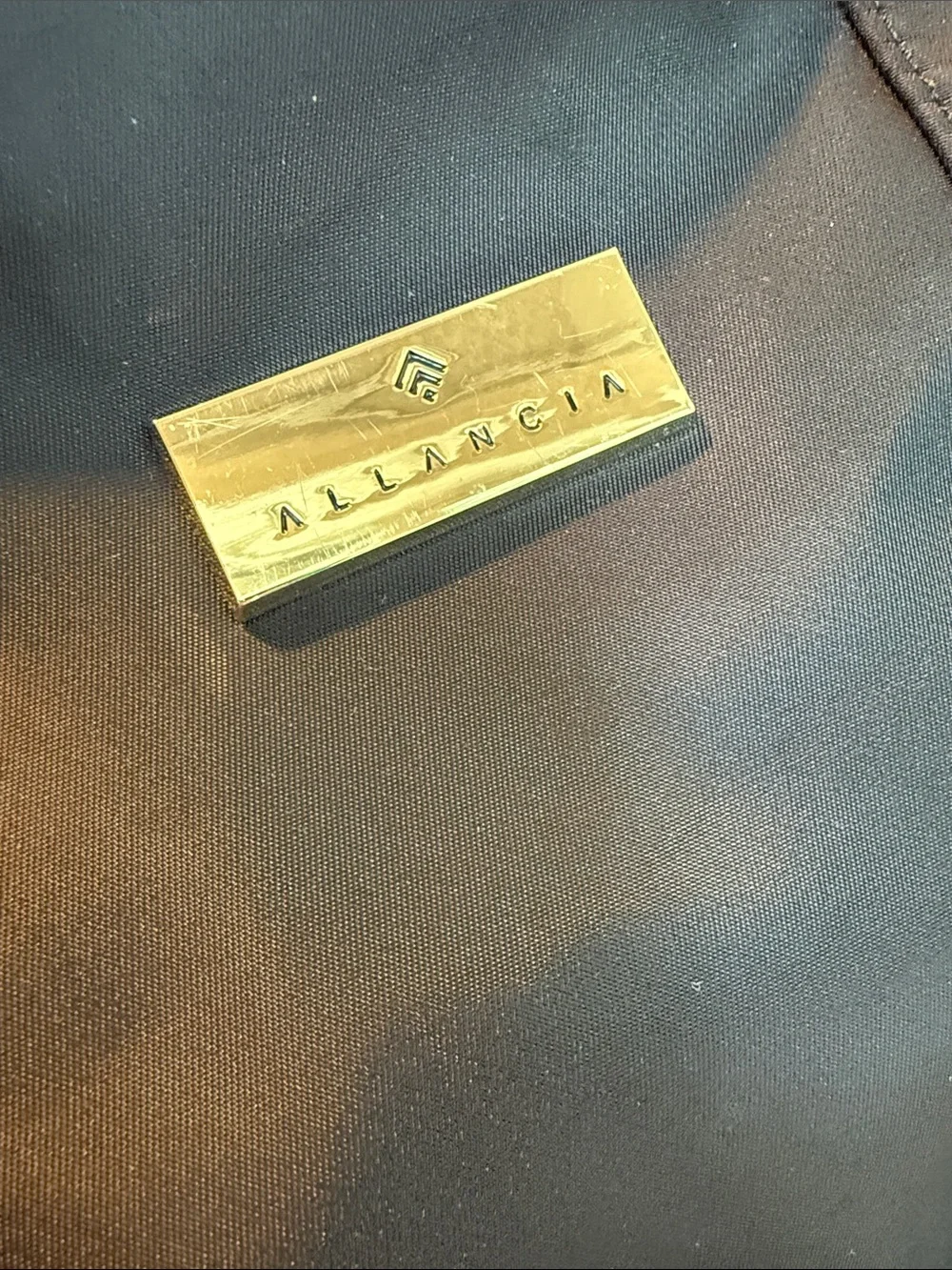 Allancia Black Nylon Backpack with Gold Accent Plaque